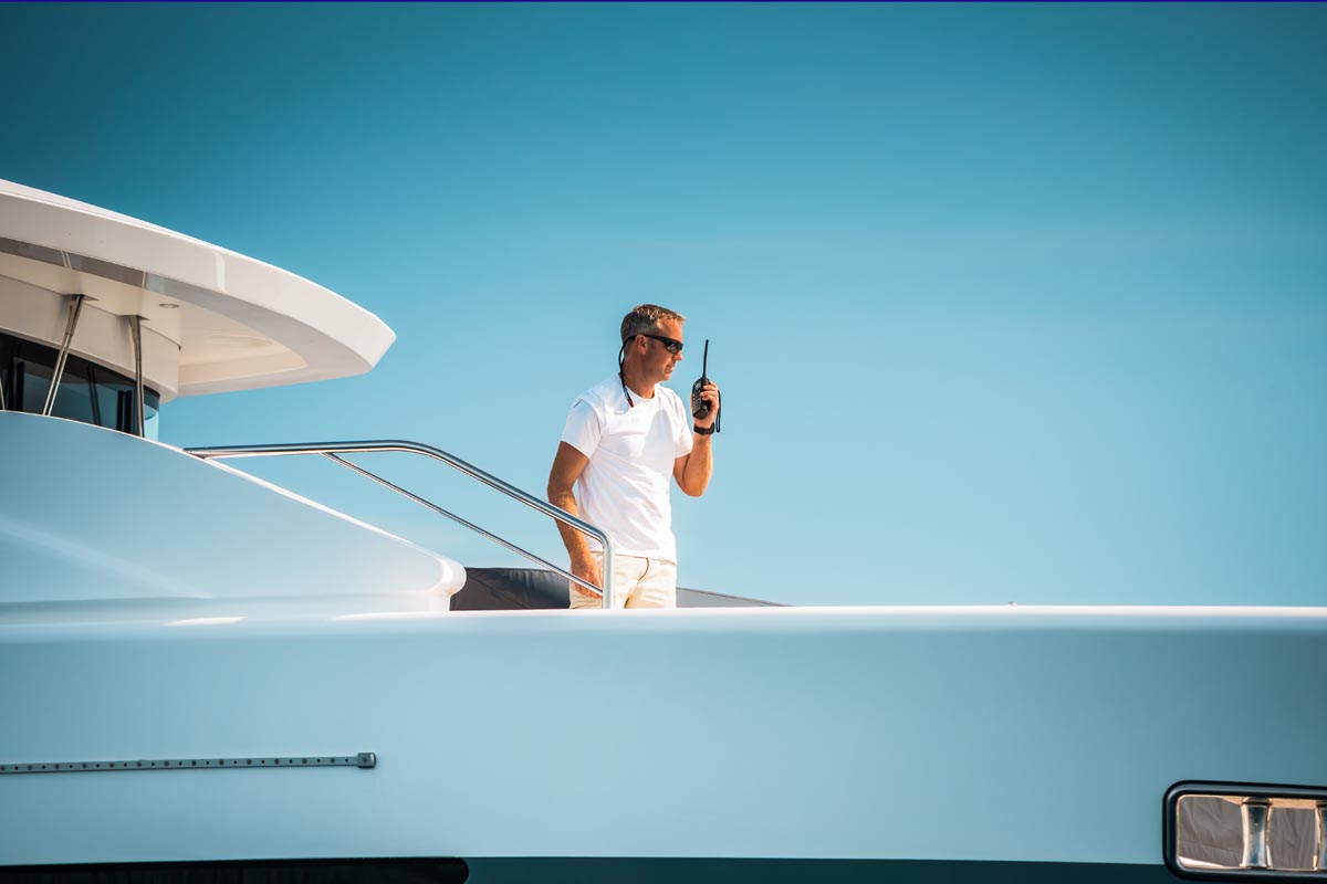 Mega yacht crew in manoeuver Mega yacht crew in manoeuver