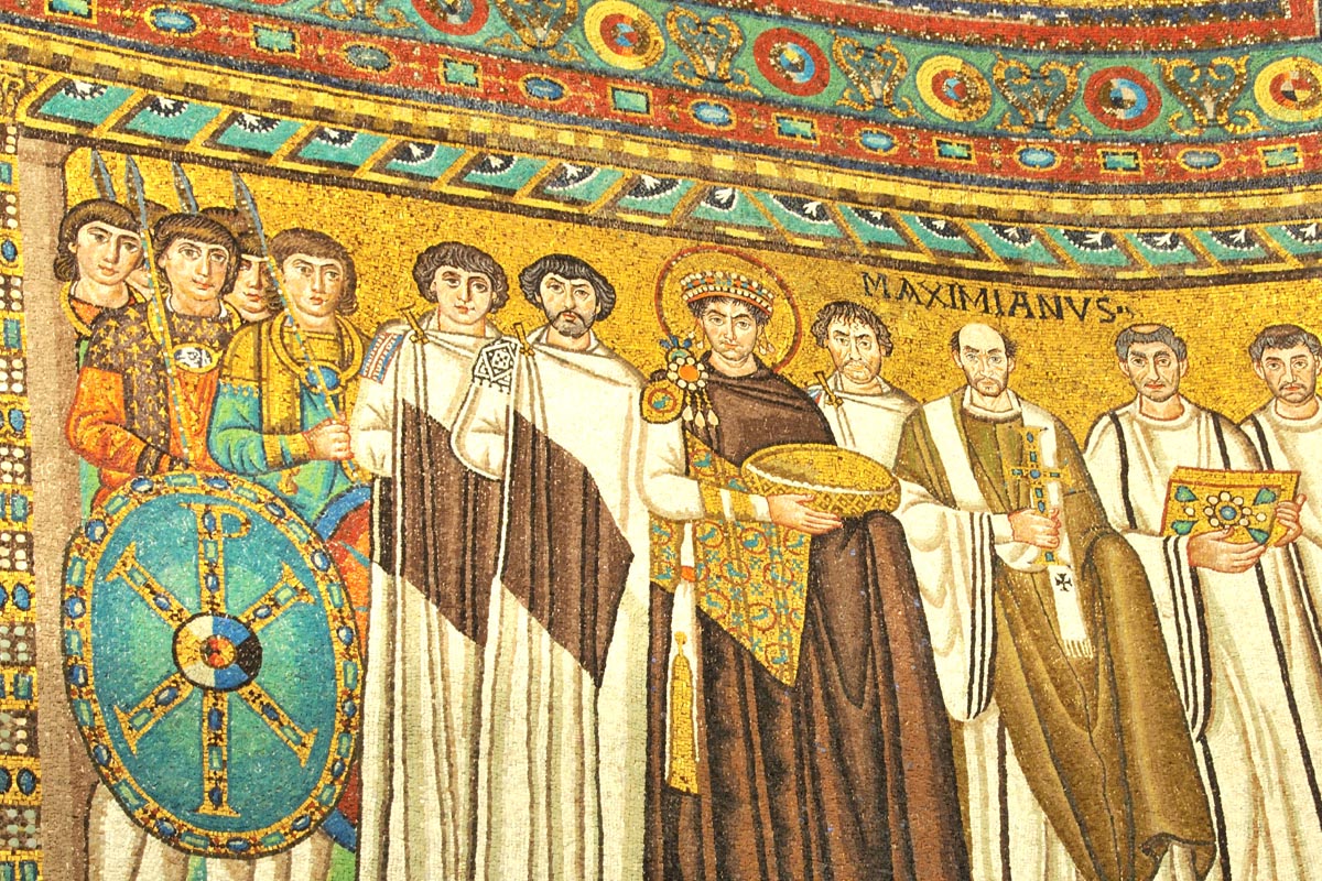 Ravenna Emperor Justinian and Bishop Maximian flanked by military and clergy The famous 1500 year old portrait of the emperor Justinian and Bishop Maximian flanked by military and clergy appearing stern and serious. Famously Justinian stands in front of Maximian, or does he?