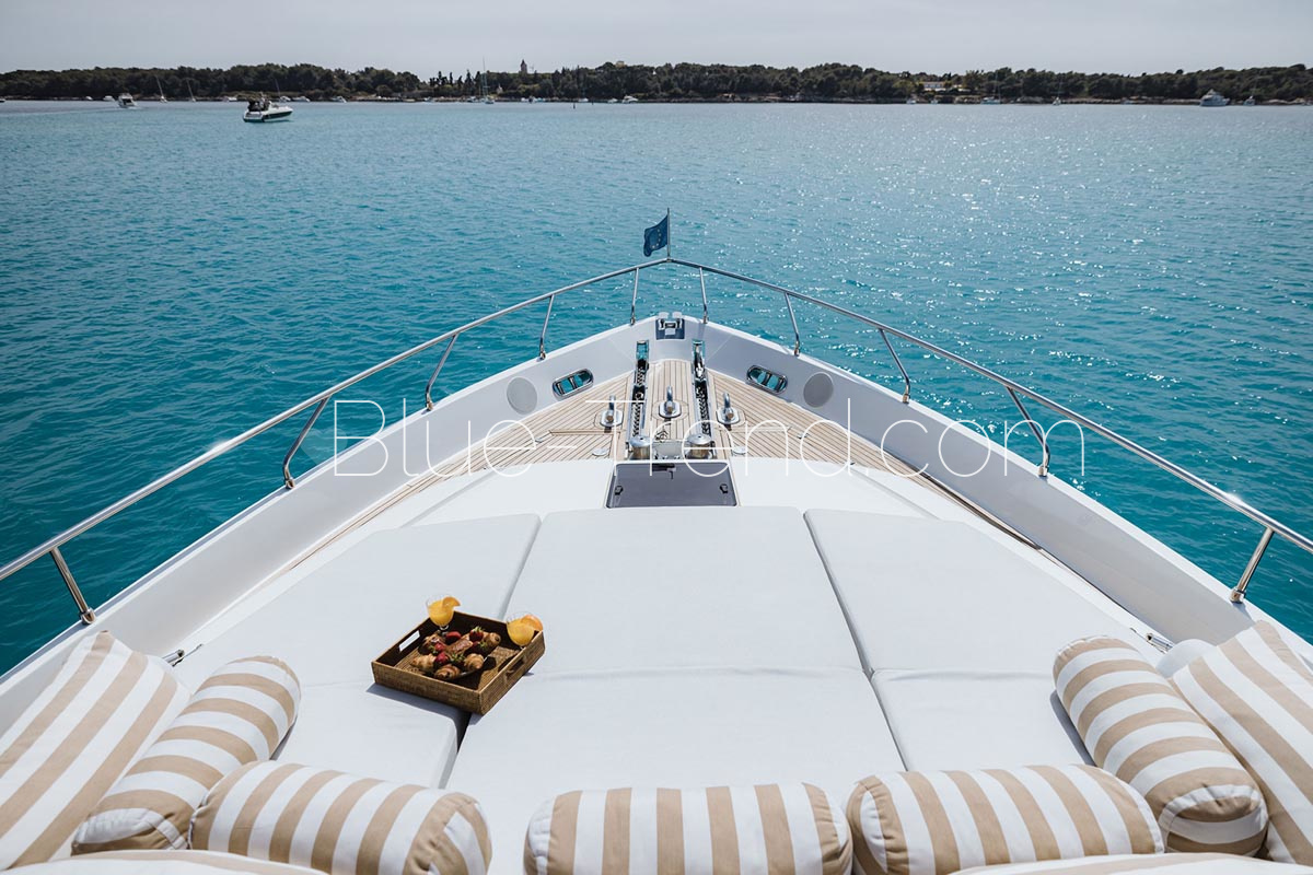 Ferretti 830 charter yacht ONYX bow sunbathing Ferretti 830 charter yacht ONYX bow sunbathing